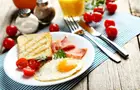 Answer FORK, TOAST, FRIED EGG, TOMATO, KNIFE, PEPPER, PLACEMAT, LADLE