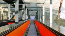 Answer escalator, down, glass, movement, bicycle, steel